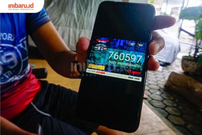 Tampilan nomor peserta lari virtual 99 Virtual Race. (Inibaru.id/ Audrian F)<br>