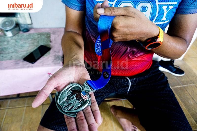 Medali milik event 99 Virtual Race. (Inibaru.id/ Audrian F)