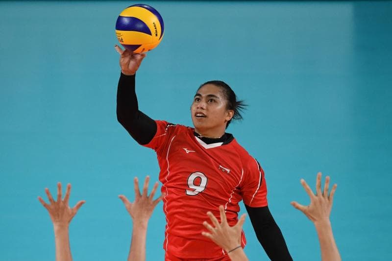 Aprilia Manganang saat masih menjadi pevoli. (Media Indonesia/AFP/Antony Wallace)