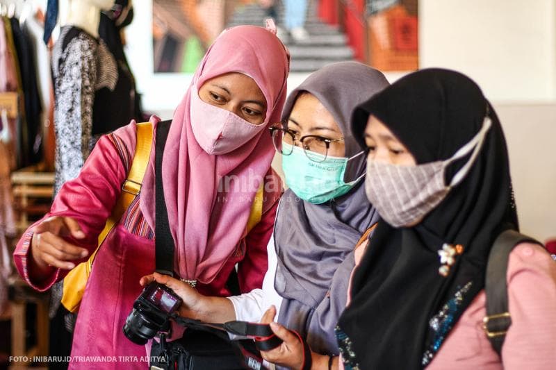 Ekspresi wisatawan saat berkunjung.