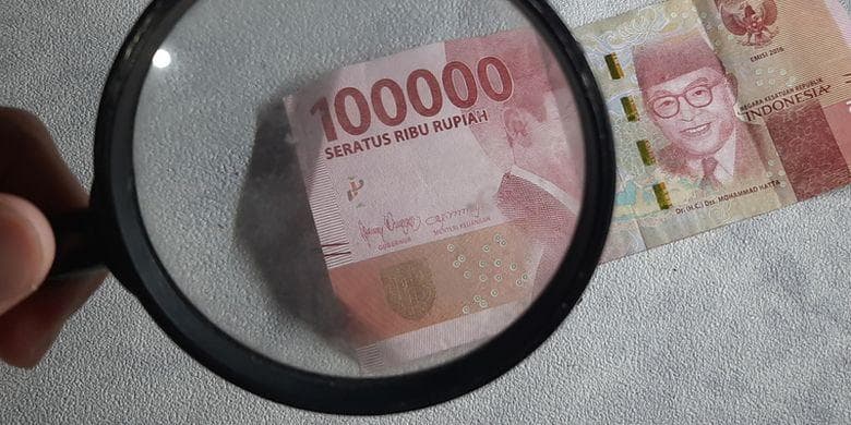 Ilustrasi uang palsu. (Shutterstock/Eva Hidayah via Kompas)
