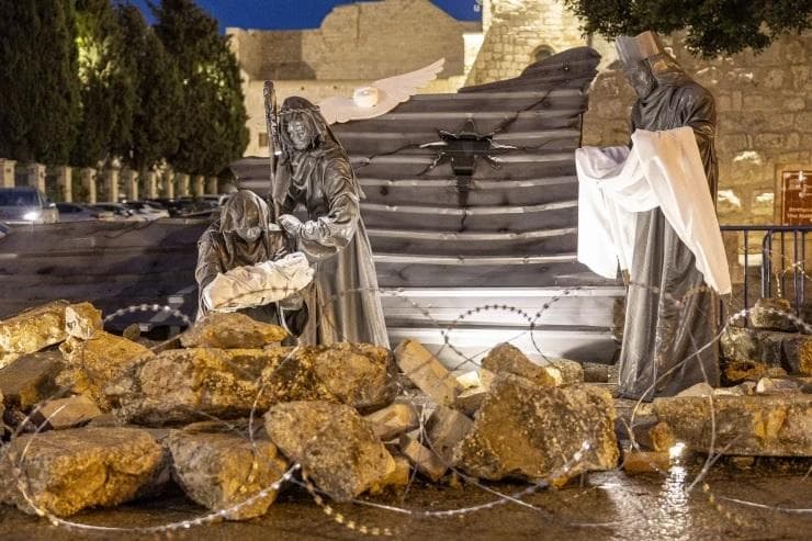Adegan Kelahiran Yesus di Betlehem terlihat sepi. (Sydney Morning Herald/Maha Hitu)