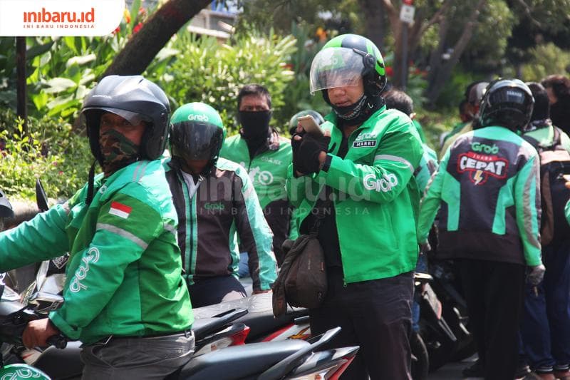 Driver ojol diminta patuhi protokol dasar yang telah ditetapkan untuk pencegahan Covid-19. (Inibaru.id/Triawanda Tirta Aditya)