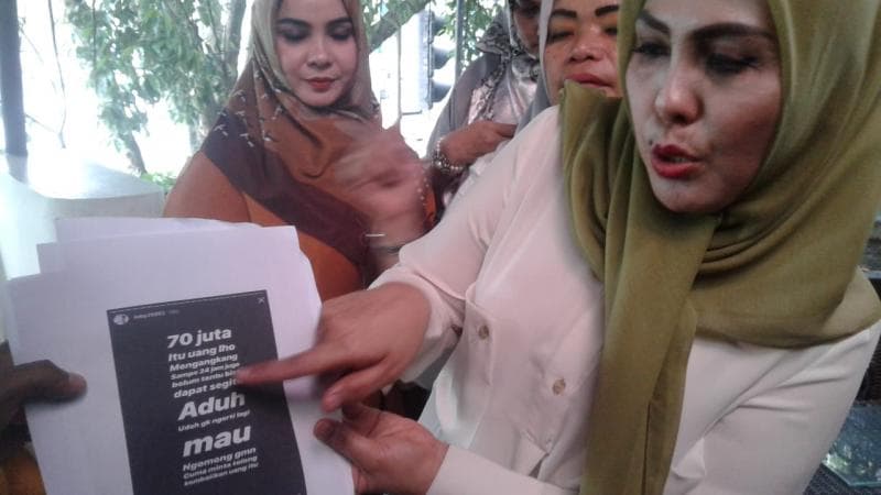 Fitriani alias 'Bu Kombes' menuntut Febi dengan pasal UU ITE. (DNA)<br>