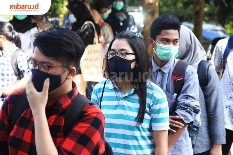 Ilustrasi: Penggunaan masker. Minggu depan, barang siapa nggak mengenakan masker di Semarang, kamu bakal kena sanksi. (Inibaru.id/ Triawanda Tirta Aditya)<br>