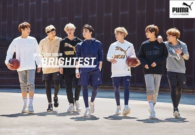 Anggota BTS memakai kaus dan sepatu Puma. (Aminoapps.com)