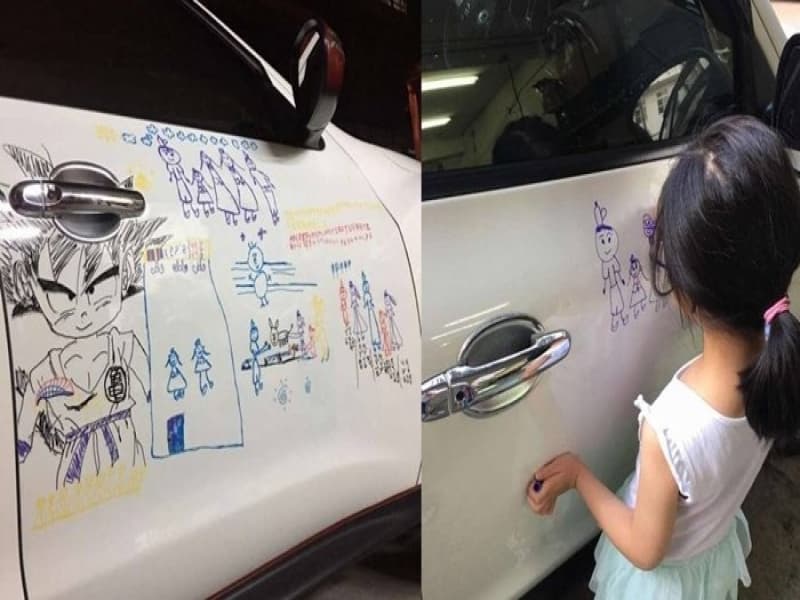 Mobil putih kepunyaan Yang, seorang pria asal Taiwan direlakan untuk digambari anaknya dengan spidol. (Tribunnews.com)