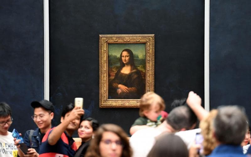Lukisan Mona Lisa menjadi magnet di Museum Louvre. (Thetelegraph/AFP/Eric Feferberg)