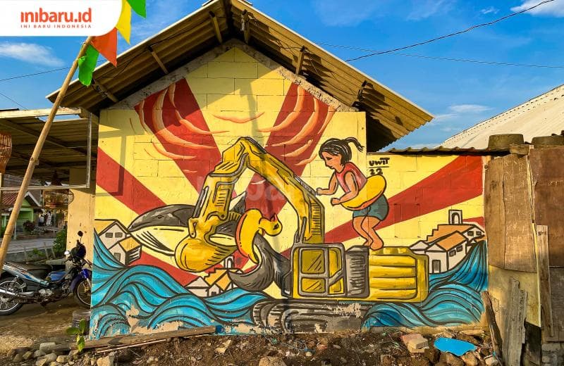 Sebuah mural karya Uwit Art Space yang berada di tengah-tengah permukiman warga Tambakrejo. (Inibaru.id/ Kharisma Ghana Tawakal)