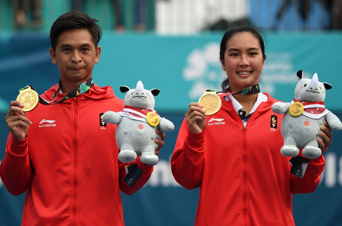 Petenis Aldila Sutjiadi dan Christopher Rungkat yang secara mengejutkan mampu meraih medali emas Asian Games 2018 (AFP/Mohd Rasfan)